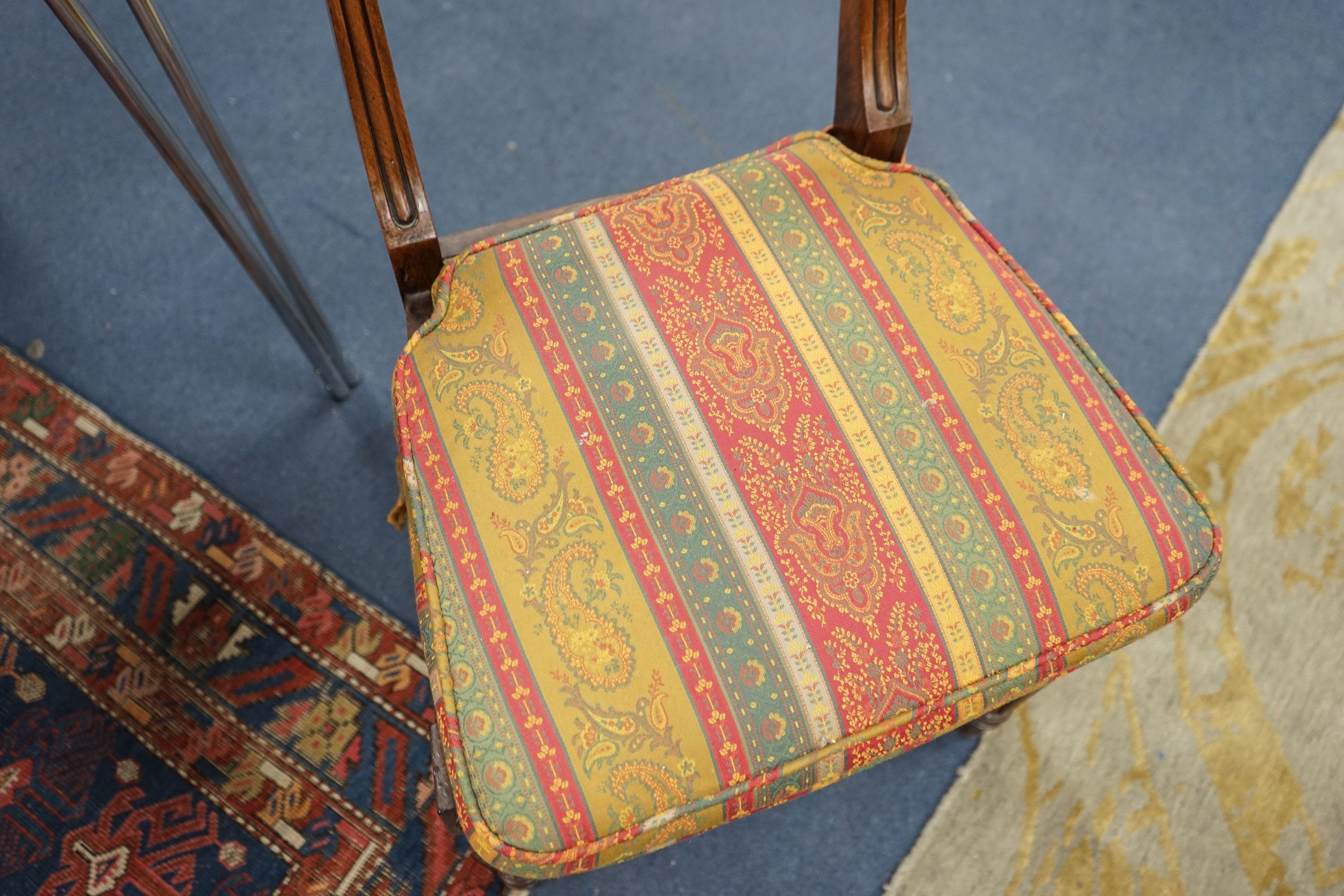 A set of six Regency faded rosewood dining chairs with squab cane seats